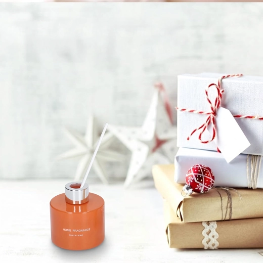 Elegantný difuzér v oranžovom skle