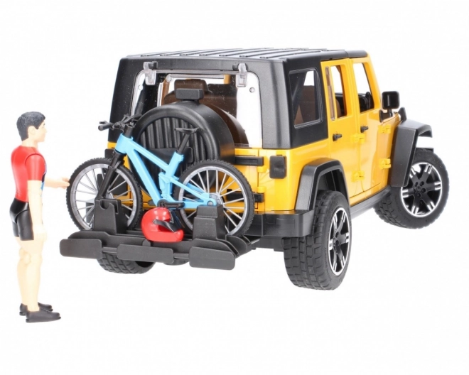 Jeep Wrangler Rubicon Unlimited s horským bicyklom a cyklistom