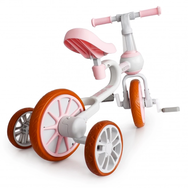 Odrážadlo 4v1 s pedálmi a bočnými kolieskami ružové Ecotoys